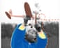 A collaged image shows a toddler in a blue coat holding up a toy airplane against the sky