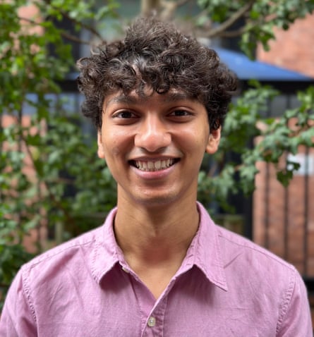 Soham Chougale smiling in a garden with greenery in the background