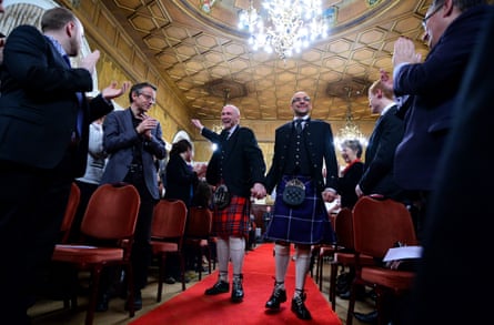 Malcolm Brown (left) and Joe Schofield marry just after midnight on 31 December 2014 in one of the first same-sex marriages to take place in Scotland.