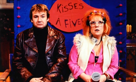 Kathy Burke and James Dreyfuss try to raise money for Comic Relief by selling kisses inside a church.