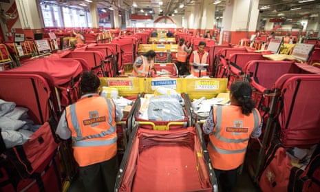 Employees sort parcels for delivery£235m profit in the same period of 2021.