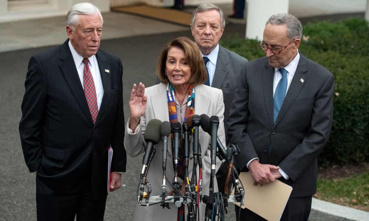 Nancy Pelosi, standing with Steny Hoyer, Dick Durbin and Chuck Schumer, speaks to reporters at the White House after meeting with Donald Trump on 2 January.