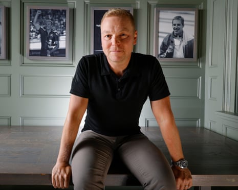 Sir Chris Hoy witting on a table