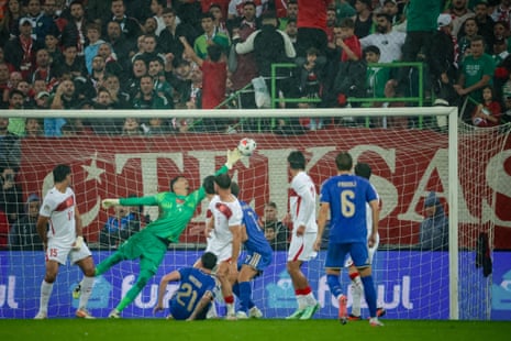Alessandro Bastoni of Italy scores.