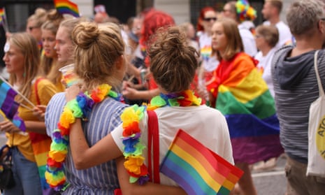 Two women with arms around each other at Copenhagen’s annual Pride parade in 2018.