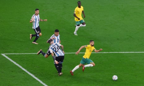 Australia’s Aziz Behich in action with Argentina’s Enzo Fernandez.