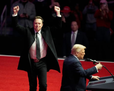Elon Musk reacts as president-elect Donald Trump speaks at a rally ahead of the presidential inauguration in January last year.