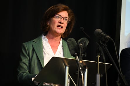 The Labour first minister, Eluned Morgan, at a podium wearing green jacket