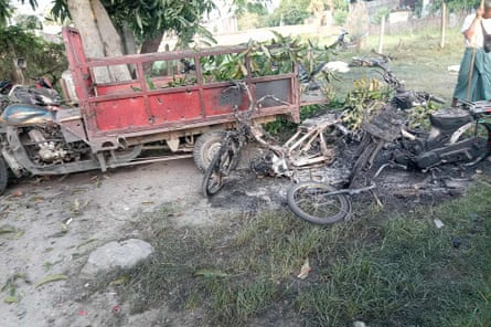 Vehicles damaged by bombs delivered by a paraglider attack in Myanmar