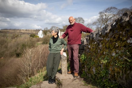 Mick Murray and Carol Taylor photographed in the Peak District close to the wall where their friend Bob Cole first noticed he was out of breath walking uphill, which was unusual as he was a mountaineer