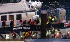 People are brought ashore after being picked up in the Channel by a Border Force vessel on 17 January