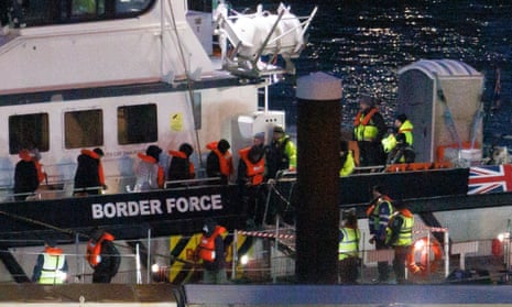 People are brought ashore after being picked up in the Channel by a Border Force vessel on 17 January
