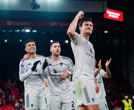 Harry Maguire leads Manchester United’s celebrations after a victory against Liverpool at Anfield