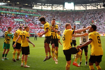 Borussia Dortmund celebrate their win in Augsburg last weekend