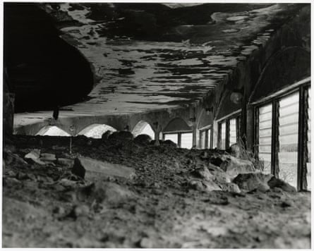 Rubble almost touches the ceiling of a building
