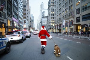 Santa Claus and a dog on skateboards in New York