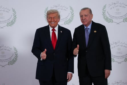 Trump and Erdoğan posing for a photo together, with thumbs up