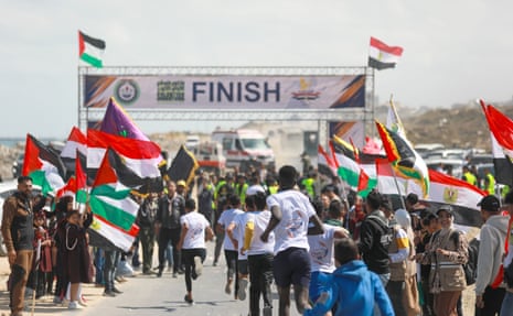 Runners close to the marathon finish line in Gaza City.