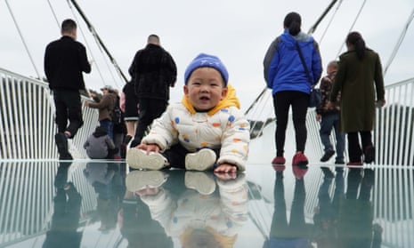 Small child on a bridge in Hunan, China