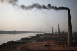 A brick factory in Dhaka, Bangladesh in December 2016. Brick fields across the country illegally use firewood instead of coal. About 2m tons of firewood is burned in the brick fields per year, which facilitates deforestation. The high chimneys along the Buriganga, Turag and Dhaleshwari river side, surrounding the Dhaka city, pollute the environment and pour harmful smoke into the air.