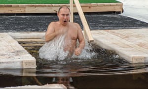 Moscow, Russia President Vladimir Putin crosses himself while bathing in icy water during a traditional Epiphany celebration as the temperature dropped to about -20 degrees outside Moscow