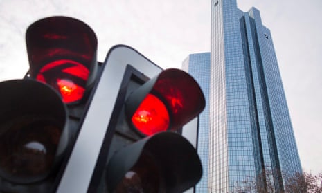 A red traffic light besides the Deutsche HQ