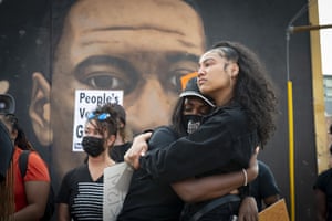 Emotions run high at a peaceful gathering of Atlanta residents beside a mural of George Floyd following the guilty verdicts for former Minneapolis police officer Derek Chauvin.