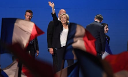 Marine Le Pen waves to supporters during an election rally
