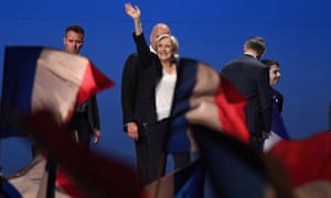 Marine Le Pen waves to supporters during an election rally