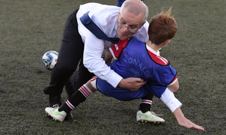 Prime minister Scott Morrison accidentally crash tackles a child during a game of football in Devonport while campaigning for the federal election.