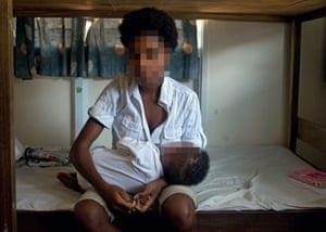 A woman and her child at a safe house in Papua New Guinea.