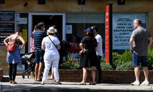 People queue for a PCR test at a doctor’s surgery in Sydney