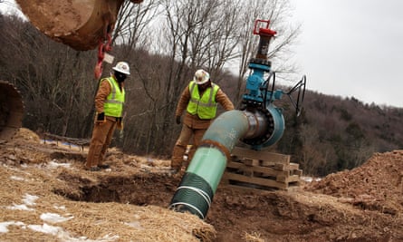 Men with Cabot Oil and Gas work on a natural gas valve at a hydraulic fracturing site on 18 January 2012 in South Montrose, Pennsylvania.