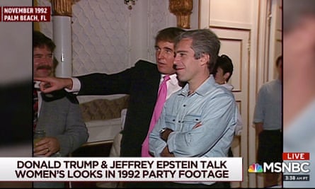 two men standing close with one man pointing