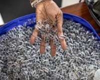 A Kenya Wildlife Services warden displays some of the syringe cartridges modified to carry live ants