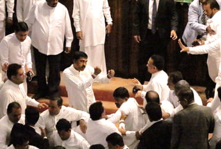 Government and opposition members confront each other in parliament
