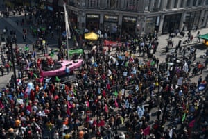 Aerial view as the Extinction Rebellion protesters congregate around a pink boat in Oxford Circus
