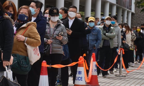 Residents line up to get tested for the coronavirus at a temporary testing centre in Hong Kong.