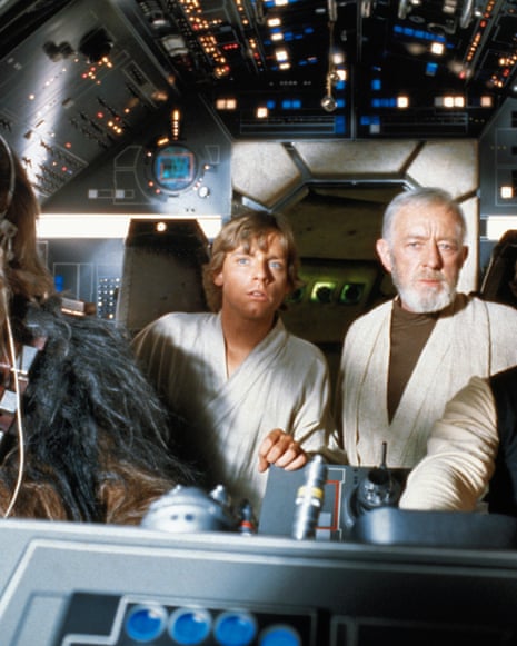 Peter Mayhew, Mark Hamill, Alec Guinness and Harrison Ford in a scene from Star Wars.