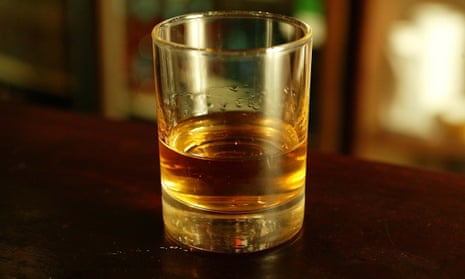 Glass of whisky on a bar
