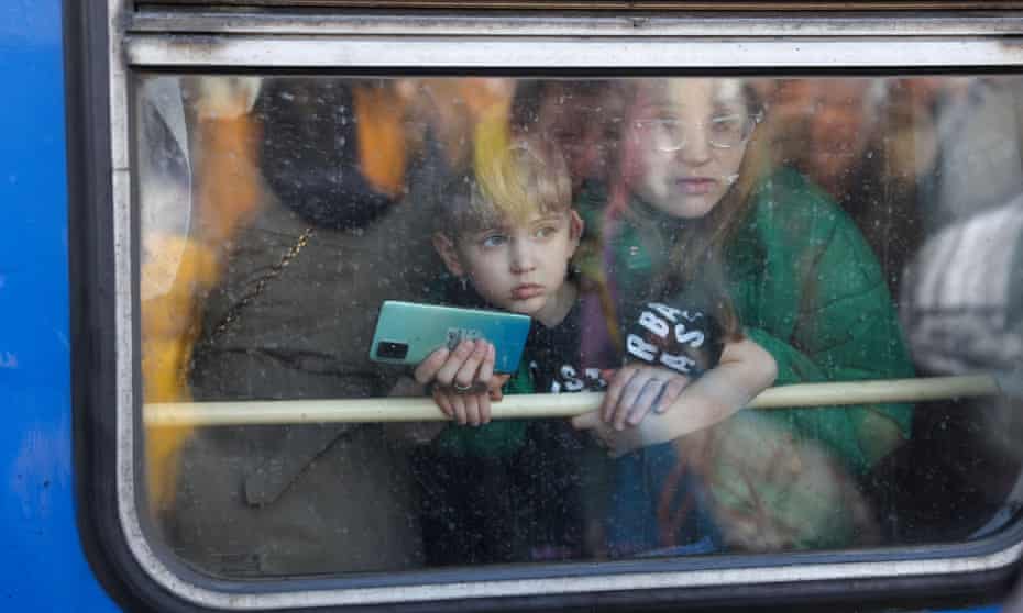 People on evacuation train from Kyiv to Lviv at Kyiv central train station