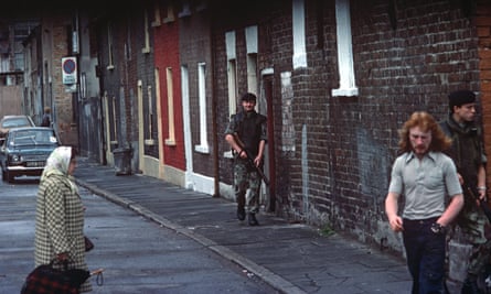 British army soldiers patrolling streets of nationalist west Belfast during the Troubles in Northern Ireland.