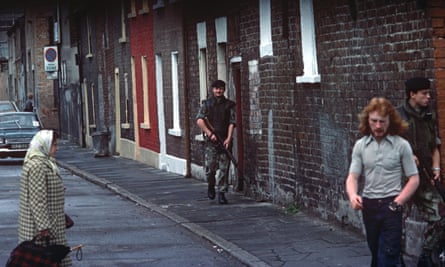 British army soldiers patrolling streets of West Belfast.