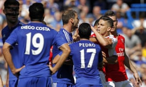 Arsenal defender Gabriel reacts after being sent off against Chelsea, while Diego Costa watches on.