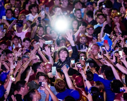 Javier walks among supporters during his arrival at a campaign rally in Rosario