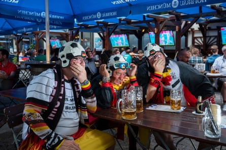 Germany fans in the Hofbräuhaus on Alexanderplatz in Berlin face up to defeat