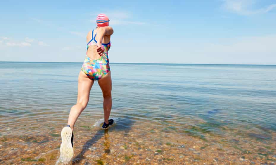 A swimmer at Tankerton beach, near Whitstable in Kent, where residents have been campaigning against Southern Water after continued discharges into the sea.