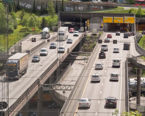 Vehicles on a dual carriageway entering and leaving a tunnel