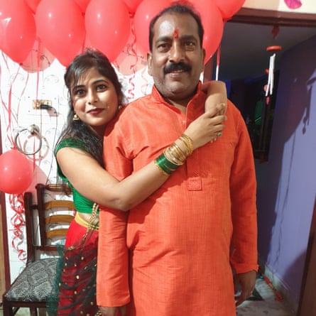 Prem Gupta with his daughter Sakshi in front of celebrationery red balloons