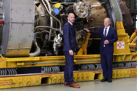 Chancellor Scholz Views Siemens Gas Turbine Intended For Nord Stream 1 PipelineMUELHEIM AN DER RUHR, GERMANY - AUGUST 03: German Chancellor Olaf Scholz (R) and Siemens Energy Chairman Christian Bruch look at the Siemens gas turbine intended for the Nord Stream 1 gas pipeline in Russia at a Siemens Energy facility on August 03, 2022 in Muelheim an der Ruhr, Germany. The turbine underwent maintenance in Canada and was supposed to already be delivered to Russia for installation back into the pipeline, but Russian energy company Gazprom has so far refused to accept the repaired turbine, citing insufficient documentation. German authorities have refuted Gazprom’s claim and say the Russian government is stalling. Russia is still supplying gas to Germany via Nord Stream 1, albeit at a much reduced flow. The two countries are at odds over the ongoing Russian war in Ukraine. (Photo by Andreas Rentz/Getty Images)